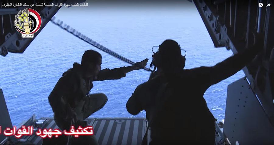 Video image released by the Egyptian Defense Ministry on May 20, 2016 shows an Egyptian plane searching in the Mediterranean Sea for the missing EgyptAir flight MS804 plane which disappeared from radar early Thursday morning while carrying 66 passengers and crew en route from Paris to Cairo.