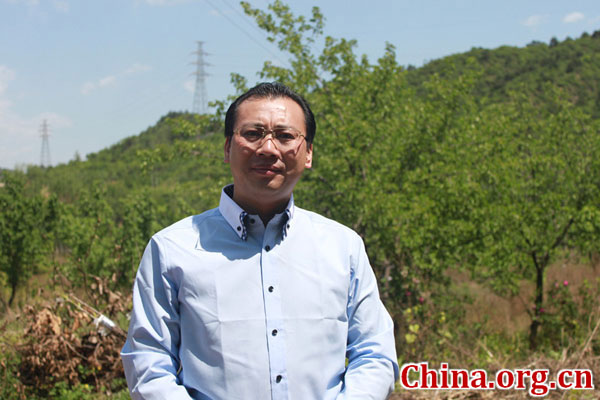 Li Guoyong, a 17th generation descendant of ancient Chinese herbalist Li Shizhen, speaks to China.org.cn in an interview in Huairou, Beijing, on May 24, 2016. [Photo by Zhang Rui / China.org.cn]