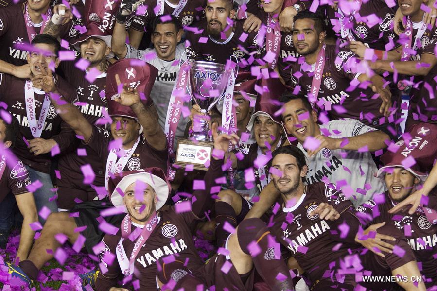 Lanus players celebrate after the final match of the First Division Tournament of Argentina, held at the Antonio Vespucio Liberti 'Monumental' Stadium in Buenos Aires, capital of Argentina, on May 29, 2016. Lanus won 4-0. [Photo/Xinhua]