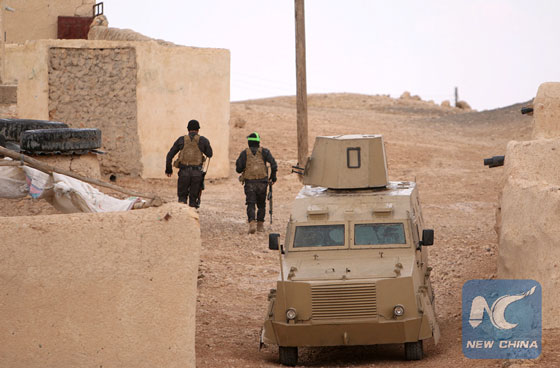 Fighters of the Syrian Democratic Forces walk in the southern rural area of Manbij, in Aleppo Governorate, Syria May 31, 2016. [Photo/Xinhua] 
