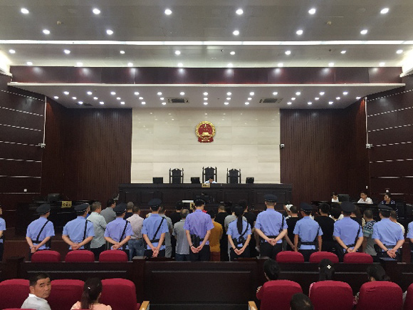 Thirty-two people in east China's Zhejiang Province have been sentenced to up to 13 years in prison for trafficking endangered animals, announced the Yongjia County People's Court on Tuesday.