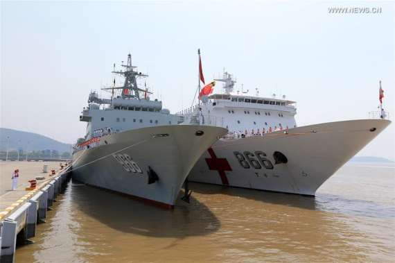 Chinese supply ship 'Gaoyou Lake' (L) and hospital ship 'Peace Ark' prepare to leave a military port in Zhoushan City, east China's Zhejiang Province, June 15, 2016, for Hawaii, the United States, to participate in the Rim of the Pacific - 2016 multinational exercises. （Photo/Xinhua)