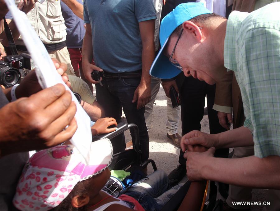 UN Secretary General Ban Ki-moon (R) visits a refugees&apos; reception center on Lesvos island, Greece on June 18, 2016. UN Secretary General Ban Ki-moon praised Greece&apos;s response to the ongoing refugee crisis during a visit to Athens on Saturday and urged the international community to provide more supports to the thousands of people fleeing conflicts. (Xinhua/Marios Lolos) 