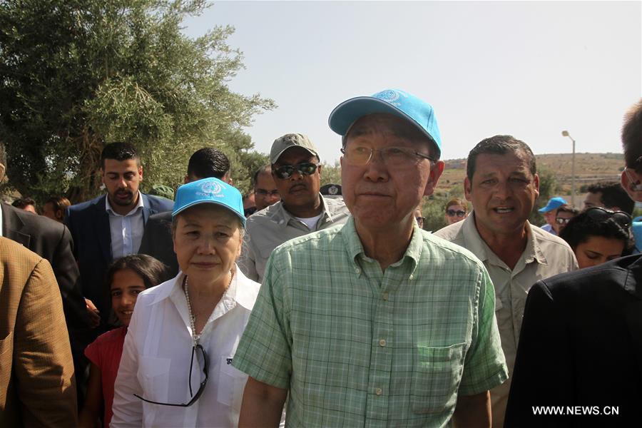 UN Secretary General Ban Ki-moon (C) visits a refugees&apos; reception center on Lesvos island, Greece on June 18, 2016. UN Secretary General Ban Ki-moon praised Greece&apos;s response to the ongoing refugee crisis during a visit to Athens on Saturday and urged the international community to provide more supports to the thousands of people fleeing conflicts. (Xinhua/Marios Lolos) 