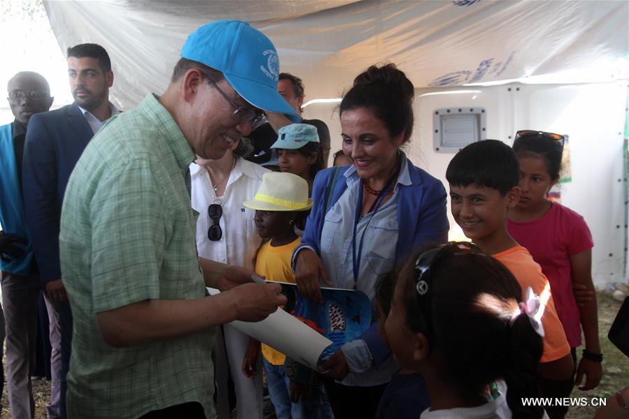 UN Secretary General Ban Ki-moon (L) visits a refugees&apos; reception center on Lesvos island, Greece on June 18, 2016. UN Secretary General Ban Ki-moon praised Greece&apos;s response to the ongoing refugee crisis during a visit to Athens on Saturday and urged the international community to provide more supports to the thousands of people fleeing conflicts. (Xinhua/Marios Lolos) 