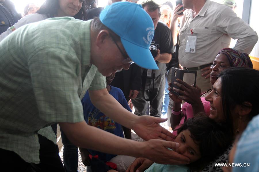 UN Secretary General Ban Ki-moon (L) visits a refugees&apos; reception center on Lesvos island, Greece on June 18, 2016. UN Secretary General Ban Ki-moon praised Greece&apos;s response to the ongoing refugee crisis during a visit to Athens on Saturday and urged the international community to provide more supports to the thousands of people fleeing conflicts. (Xinhua/Marios Lolos) 