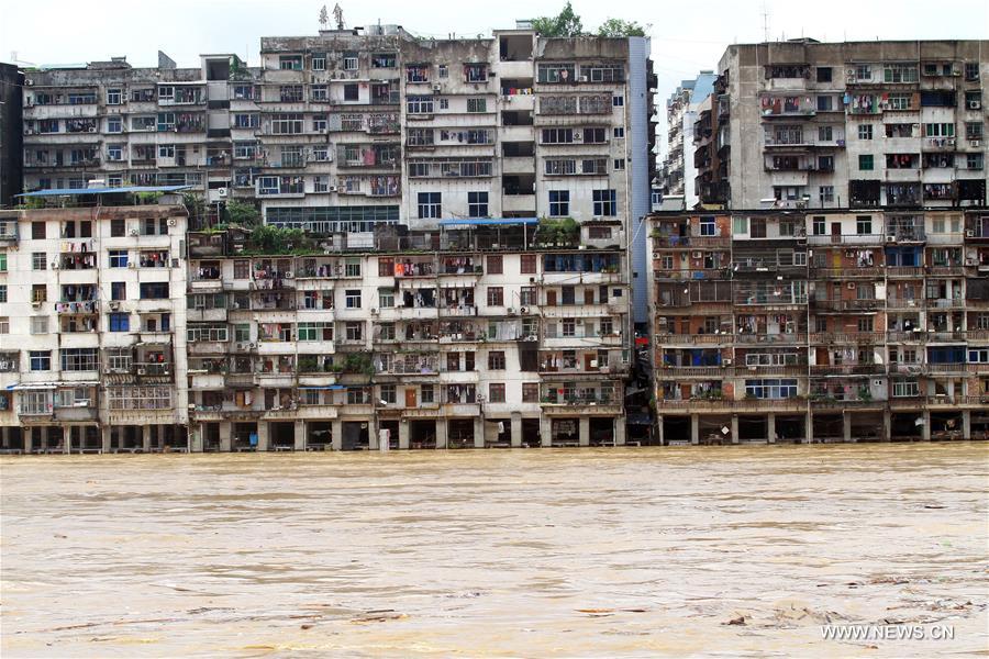 The bottom of residential buildings are submerged by flood water in Shunchang County of Nanping City, southeast China&apos;s Fujian Province, June 18, 2016. Torrential railfall has pushed water level of a branch of the Minjiang River to surpass its warning line, flooding residential quarters and interrupting traffic in Shunchang County. (Xinhua/Chen Baicai) 