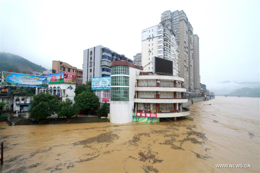 The bottom of a buildings is submerged by flood water in Shunchang County of Nanping City, southeast China&apos;s Fujian Province, June 18, 2016. Torrential railfall has pushed water level of a branch of the Minjiang River to surpass its warning line, flooding residential quarters and interrupting traffic in Shunchang County. (Xinhua/Chen Baicai) 