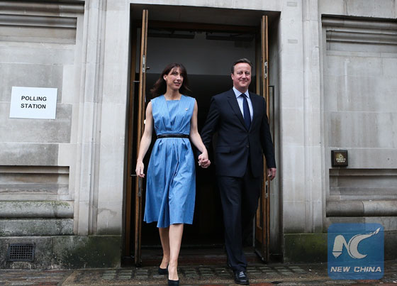 Britain's Prime Minister, David Cameron and his wife Samantha leave the Central Methodist Hall polling station after casting their votes for the EU Referendum in London, on June 23, 2016. [Photo/Xinhua]