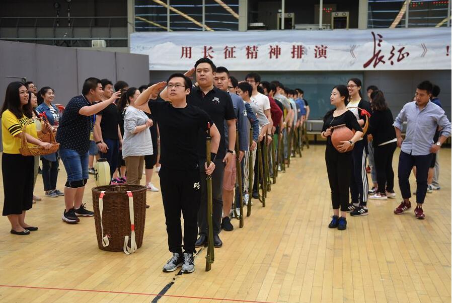 Actors and actresses practice during rehearsal of their new opera The Long March in Beijing, capital of China, June 16, 2016. In order to commemorate the 80th anniversary of the victory of Red Army's Long March, National Centre for the Performing Arts invited domestic first-class artists including Yin Qing, Zou Jingzhi, Tian Qinxin and Yang Xiaoyang to constitute the creative group of opera The Long March. The opera will premier from July 1 to July 6. (Xinhua/Luo Xiaoguang)