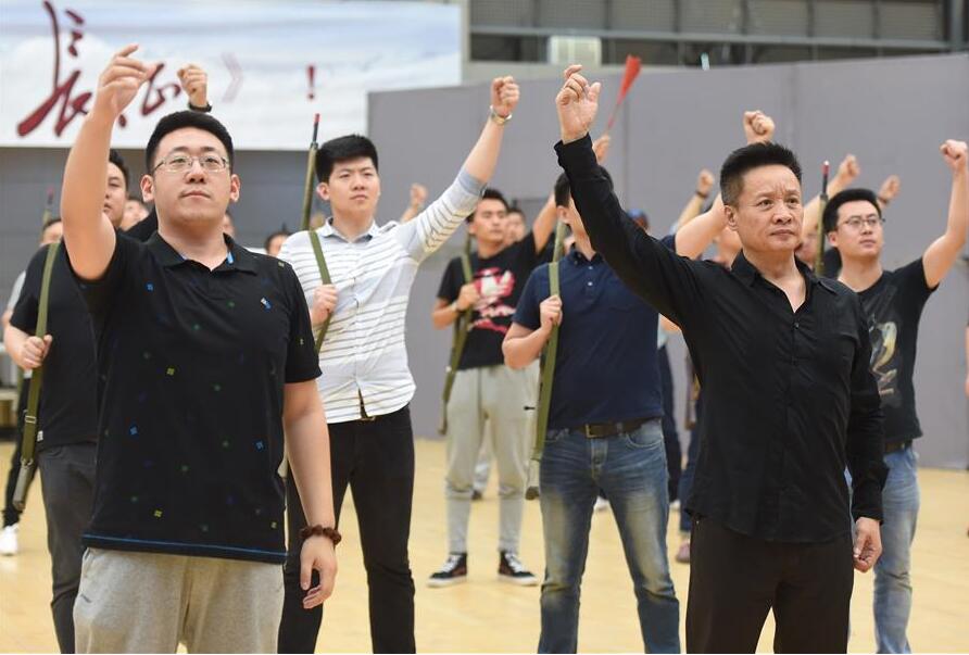 Singer Yan Weiwen (R front) and other actors practice during rehearsal of their new opera The Long March in Beijing, capital of China, June 16, 2016. In order to commemorate the 80th anniversary of the victory of Red Army's Long March, National Centre for the Performing Arts invited domestic first-class artists including Yin Qing, Zou Jingzhi, Tian Qinxin and Yang Xiaoyang to constitute the creative group of opera The Long March. The opera will premier from July 1 to July 6. (Xinhua/Luo Xiaoguang) 