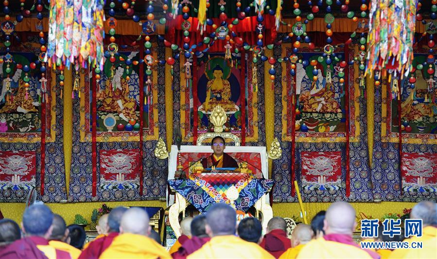 The 11th Panchen Lama, Bainqen Erdini Qoigyijabu, conducts Buddhist services at the Zhaxi Lhunbo Lamasery on July 4 and performs an abhiseca -- a Tibetan strength-giving ceremony -- for thousands of monks and pilgrims. [Xinhua] 