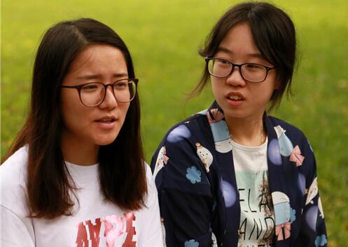 Wang Wang Shujie (L) and Pan Yue are students at Capital Normal University.