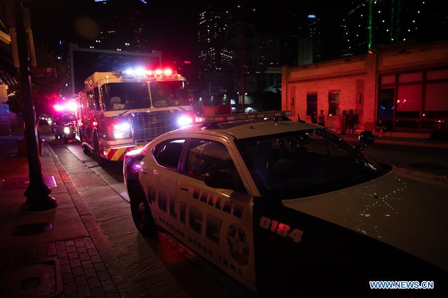 Secutiry force is strengthened in downtown Dallas following the sniper shooting in Dallas, the United States, July 7, 2016. Four police officers were killed and seven others injured as two snipers opened fire in downtown Dallas during a protest against officer-involved shootings across the United States on Thursday night. (Xinhua/Tian Dan)