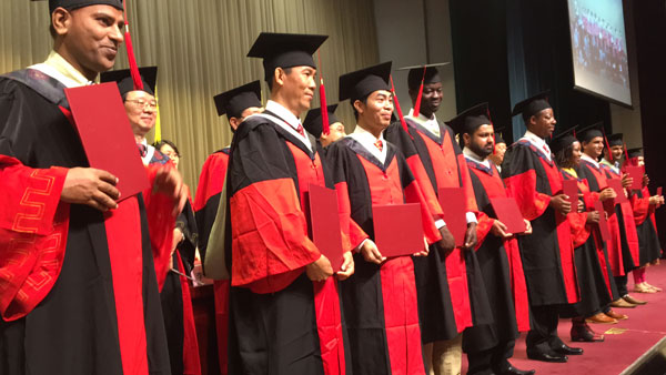 Foreign PhD students attend a graduation ceremony of the Chinese Academy of Agricultural Sciences in Beijing.[Photo by Yan Dongjie/chinadaily.com.cn] 