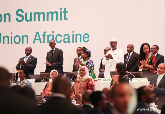 President of the Republic of Chad and rotating African Union chairperson Idriss Deby (4th R, on stage), President of Rwanda Paul Kagame (2nd L, on stage), Chairperson of the African Union Commission (AUC) Nkosazana Dlamini Zuma (4th L, on stage) and Deputy Chairperson of the AUC Erastus Mwencha (1st L, on stage) attend the opening ceremony of the 27th ordinary session of the AU Heads of States, in Kigali, Rwanda, July 17, 2016. [Photo/Xinhua]