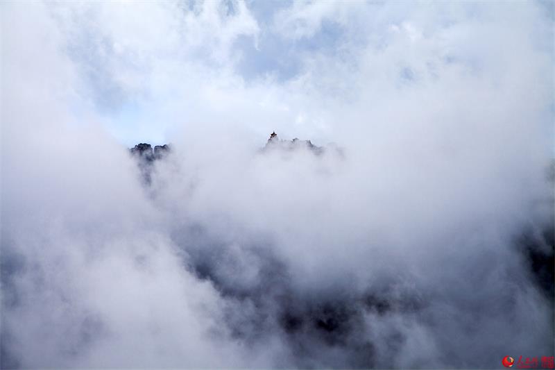 Luya Mountain shrouded in mist after a rain - C