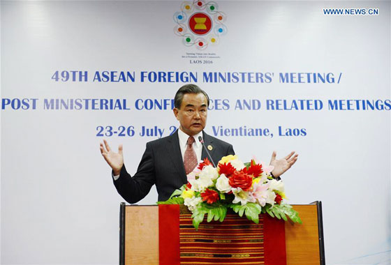 Chinese Foreign Minister Wang Yi attends a press conference after the meeting between Chinese Foreign Minister and the counterparts from 10 ASEAN members in Vientiane, Laos, July 25, 2016. [Photo/Xinhua]