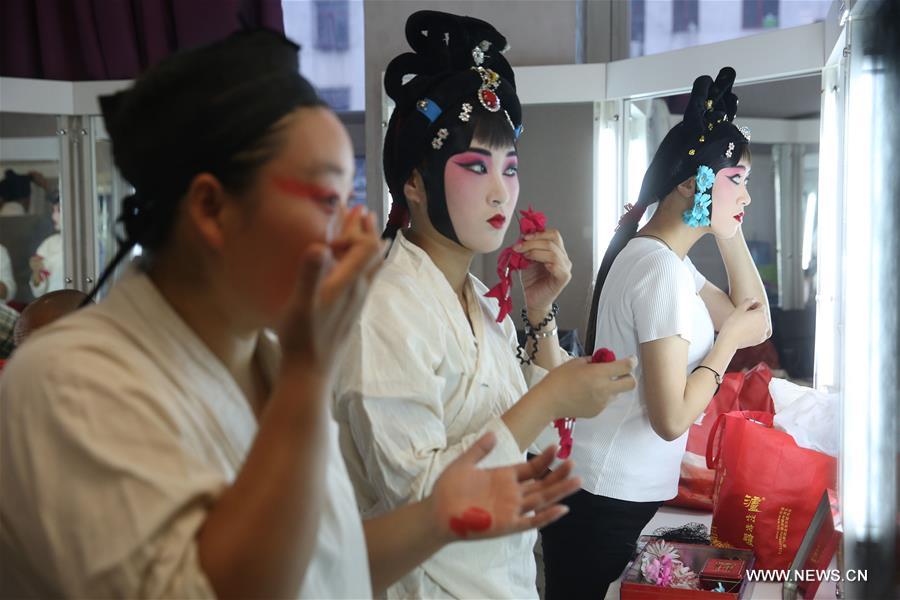 Actresses of Hebei Bangzi apply make-up before a performance during 2016 China Hebei Bangzi Festival in Gu&apos;an, north China&apos;s Hebei Province, July 29, 2016. Hebei Bangzi, or Hebei Opera, is the main type of opera in Hebei Province which became popular in Qing Dynasty (1644-1911). Like Peking Opera, it&apos;s a traditional Chinese opera which combines music, vocal performance, dance, acrobatics and etc. (Xinhua/Cai Yang) 