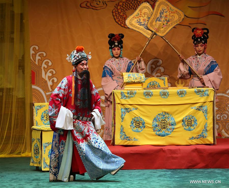Actors of Hebei Bangzi perform on stage during 2016 China Hebei Bangzi Festival in Gu&apos;an, north China&apos;s Hebei Province, July 29, 2016. Hebei Bangzi, or Hebei Opera, is the main type of opera in Hebei Province which became popular in Qing Dynasty (1644-1911). Like Peking Opera, it&apos;s a traditional Chinese opera which combines music, vocal performance, dance, acrobatics and etc. (Xinhua/Cai Yang) 