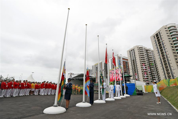 The Chinese delegation to the 2016 Rio Olympic Games participate the flag-raising ceremony at the Olympic Village in Rio de Janeiro, Brazil, on Aug. 3, 2016. (Xinhua/Shen Bohan)  