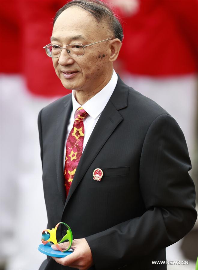 Chef de mission of Chinese delegation and director of General Administration of Sports of China Liu Peng (L) attends the flag-raising ceremony at the Olympic Village in Rio de Janeiro, Brazil, on Aug. 3, 2016. (Xinhua/Ren Zhenglai) 