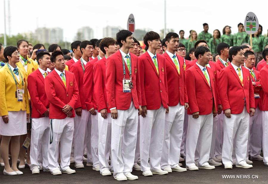 Members of the Chinese delegation to the 2016 Rio Olympic Games participate the flag-raising ceremony at the Olympic Village in Rio de Janeiro, Brazil, on Aug. 3, 2016. (Xinhua/Yue Yuewei) 