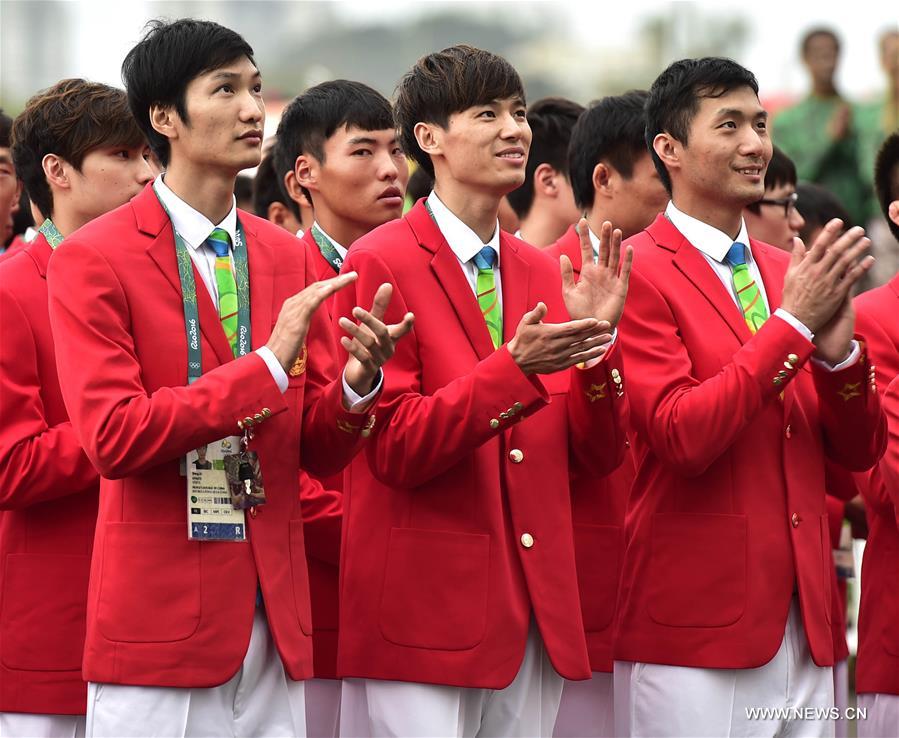 Members of the Chinese delegation to the 2016 Rio Olympic Games participate the flag-raising ceremony at the Olympic Village in Rio de Janeiro, Brazil, on Aug. 3, 2016. (Xinhua/Yue Yuewei) 