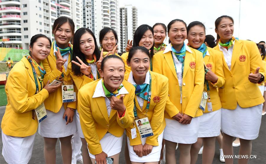 Members of the Chinese delegation pose for photos prior to the flag-raising ceremony at the Olympic Village in Rio de Janeiro, Brazil, on Aug. 3, 2016. (Xinhua/Yue Yuewei) 