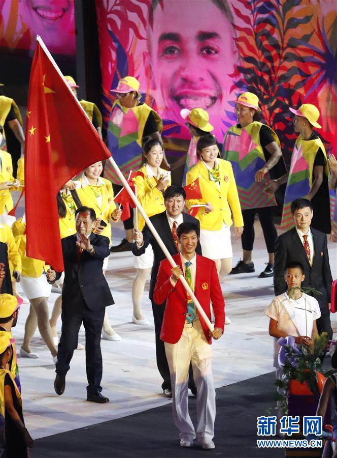 The Chinese delegation, led by flag bearer Lei Sheng, marches into the Maracana Stadium in the Rio Olympic Games opening ceremony on Friday. [Photo/Xinhua]