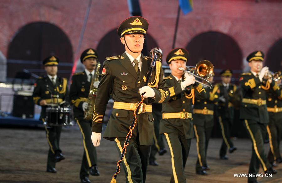 The Military Band of the People&apos;s Liberation Army of China perform at a massive march show during the Hamina Tattoo International Military Music Festival in Hamina, Finland, Aug. 4, 2016. (Xinhua/Zhang Xuan) 