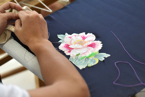 Traditional embroidery being taught by the Minority Culture Heritage Center in Guizhou Forerunner College. [Photo by Cecile Zehnacker]