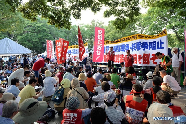 People attend a protest near the Peace Momorial Park in Hiroshima, Japan, on Aug. 6, 2016. Hiroshima, the city that suffered U.S. atomic bombing in 1945 during World War II, commemorated the 71st anniversary of the bombing on Saturday at the city's Peace Memorial Park. [Xinhua]