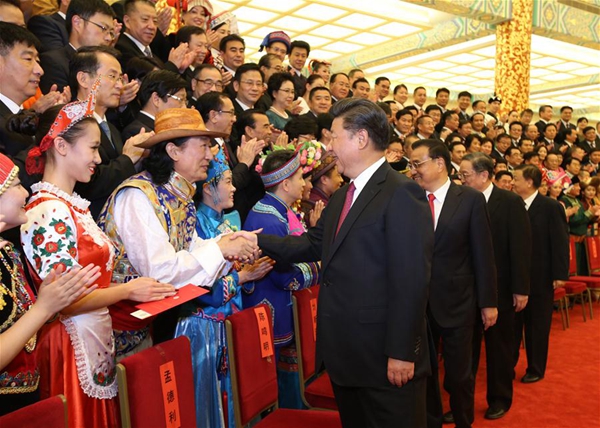 Chinese President Xi Jinping, Chinese Premier Li Keqiang, and Yu Zhengsheng, chairman of the National Committee of the Chinese People's Political Consultative Conference, Liu Yunshan, a member of the Standing Committee of the Political Bureau of the Communist Party of China Central Committee, meet with representatives of performers before an opening gala of the Fifth Minorities Art Festival in Beijing, capital of China, Aug. 18, 2016. 