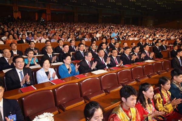 Chinese President Xi Jinping, Chinese Premier Li Keqiang, and Yu Zhengsheng, chairman of the National Committee of the Chinese People's Political Consultative Conference, Liu Yunshan, a member of the Standing Committee of the Political Bureau of the Communist Party of China Central Committee, and other senior leaders with over 3,000 spectators watch an opening gala of the Fifth Minorities Art Festival held at the Great Hall of the People in Beijing, capital of China, Aug. 18, 2016. [Xinhua/Yao Dawei]