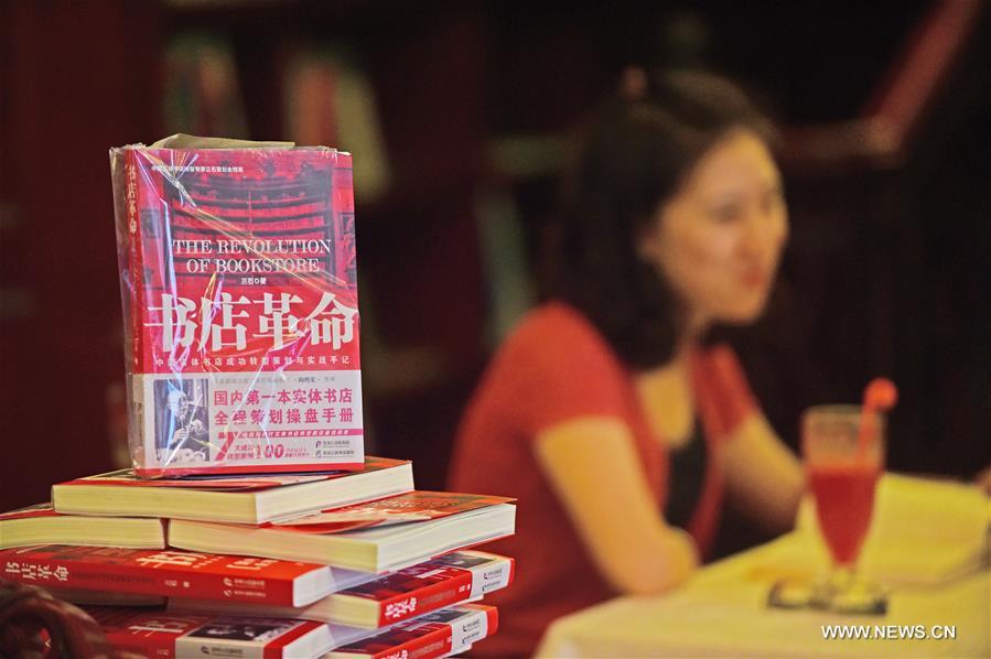 People relax at Goethe Bookstore in Shenyang, northeast China's Liaoning Province, Aug. 18, 2016. Goethe Bookstore, a 24-hour bookstore featuring books of social science, original books of German, French, and English, vinyl records, exotic gifts, art performances and reading clubs, opened Thursday in an ancient building at Zhongshan Square in Shenyang. [Xinhua]