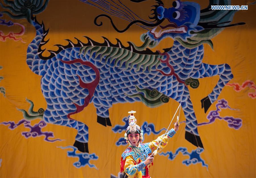 An artist performs Peking Opera during a reopening ceremony for the Sanqingyuan Opera House in Beijing, capital of China, Aug 18, 2016. Located on Qianmen Street, Sanqingyuan once was well-known as one of 'the Seven Opera Houses in Beijing,' then was changed to be a part of the Dashilan shopping district. After three years' construction based on its old pictures, the place reopened on Thursday as an opera house again. [Photo/Xinhua]