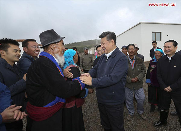 Chinese President Xi Jinping shakes hands with villagers in Wushi Township of Huzhu Tu Autonomous County in Haidong, Qinghai province, Aug 23, 2016. [Photo/Xinhua] 