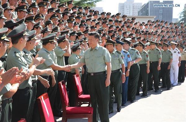 Chinese President Xi Jinping (R, Front), also general secretary of the Communist Party of China Central Committee and chairman of the Central Military Commission, shakes hands with representatives during an inspection of the offices of the People's Liberation Army (PLA) Strategic Support Force, Aug. 29, 2016. (Xinhua/Li Gang)