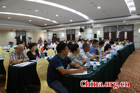 The seminar, held in Beijing on Aug. 28, aims to promote a low-carbon, eco-friendly way of breeding pigs in China. [Photo/China.org.cn]