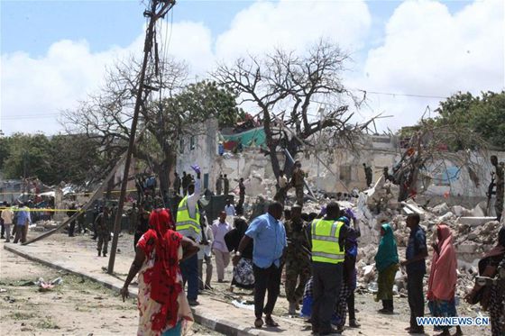 People gather at the explosion site in Mogadishu, capital of Somalia, on Aug. 30, 2016. [Photo/Xinhua]