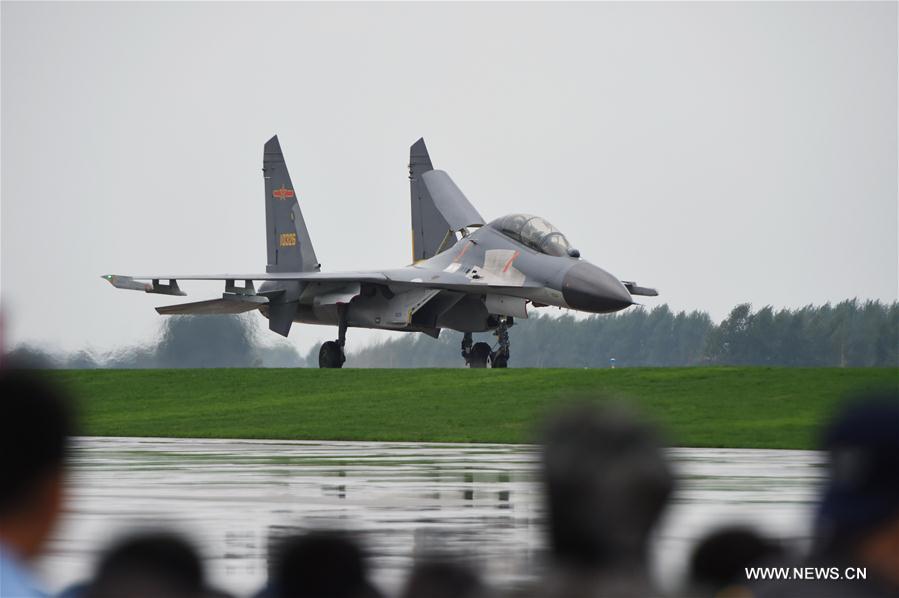 A J-11B fighter is seen during the PLA Air Force Aviation Open Day in Changchun, capital city of northeast China&apos;s Jilin Province, Sept. 2, 2016. The open day aims to demonstrate the achievements of Chinese People&apos;s Liberation Army (PLA) air force and enhance the public awareness of aerospace safety. Some equipments of the PLA air force will be open to the public for the first time. (Xinhua/Zhang Nan) 