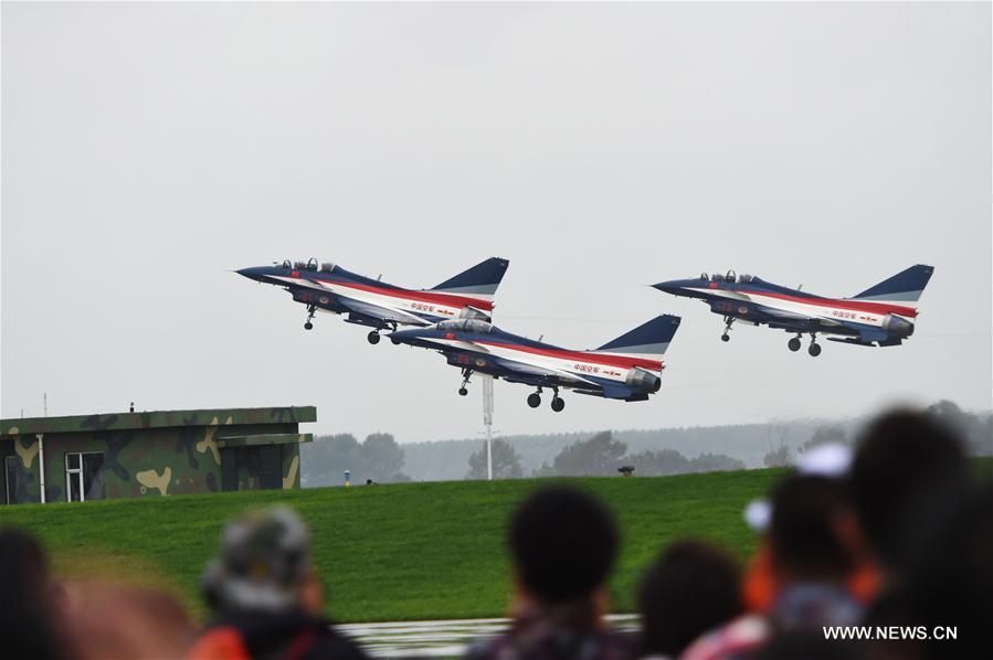 The Bayi Aerobatics Team performs during the PLA Air Force Aviation Open Day in Changchun, capital city of northeast China&apos;s Jilin Province, Sept. 2, 2016. The open day aims to demonstrate the achievements of Chinese People&apos;s Liberation Army (PLA) air force and enhance the public awareness of aerospace safety. Some equipments of the PLA air force will be open to the public for the first time. (Xinhua/Zhang Nan) 