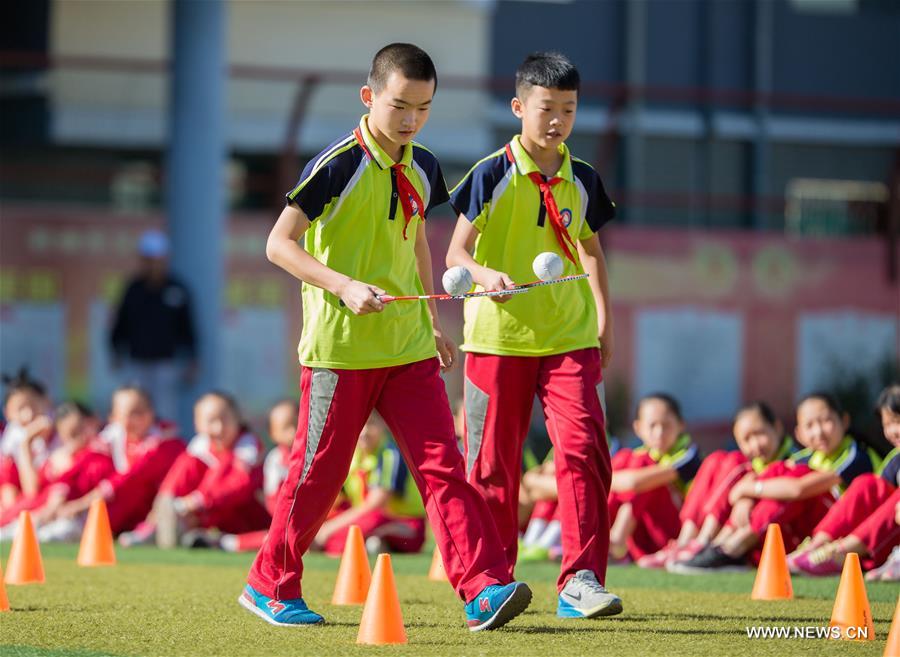 Students play games at Tongshunjie Primary School in Yuquan District of Hohhot, capital of north China&apos;s Inner Mongolia Autonomous Region, Sept. 2, 2016. Activities were held at Tongshunjie Primary School on Friday to help students quickly adapt themselves to the new school life. (Xinhua/Ding Genhou) 