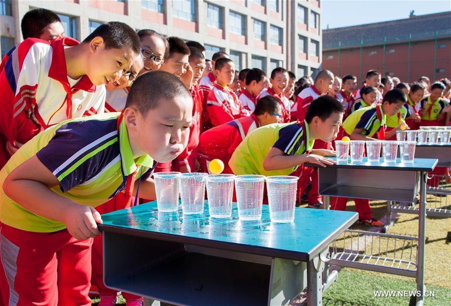 Students play games at Tongshunjie Primary School in Yuquan District of Hohhot, capital of north China&apos;s Inner Mongolia Autonomous Region, Sept. 2, 2016. Activities were held at Tongshunjie Primary School on Friday to help students quickly adapt themselves to the new school life. (Xinhua/Ding Genhou) 