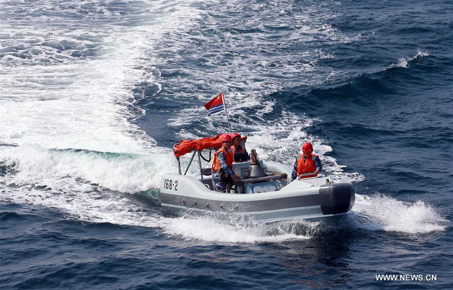 Chinese frigate 'Huangshan' sends rescuers to a merchant ship in danger during a China-Russia naval joint drill at sea off south China's Guangdong Province, Sept. 16, 2016. Chinese and Russian fleets conducted joint operation exercise off Guangdong Province in the South China Sea during the 'Joint Sea 2016' drill on Friday. [Photo/Xinhua] 