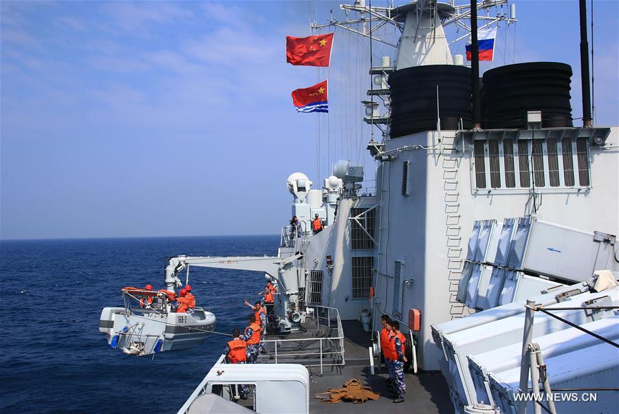 Chinese frigate 'Huangshan' sends rescuers to a merchant ship in danger during a China-Russia naval joint drill at sea off south China's Guangdong Province, Sept. 16, 2016. Chinese and Russian fleets conducted joint operation exercise off Guangdong Province in the South China Sea during the 'Joint Sea 2016' drill on Friday. [Photo/Xinhua] 