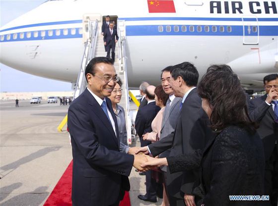 Chinese Premier Li Keqiang (1st L) and his wife Cheng Hong (2nd L) arrive at John F. Kennedy International Airport in New York, the United States, Sept. 18, 2016. [Photo/Xinhua]