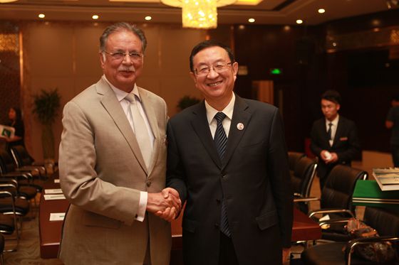 Luo Shugang, Chinese minister of culture (R) shakes hand with Pakistan's Federal Minister for Information, Broadcasting and National Heritage Pervaiz Rashid (L) in Dunhuang city of Gansu province, China on Sept. 19, 2016.