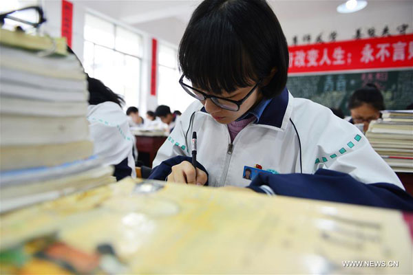 A student studies in a classroom of Minzu High School in Jianhe County, southwest China's Guizhou Province. [Photo: Xinhua]
